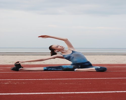 Woman stretching in morning light